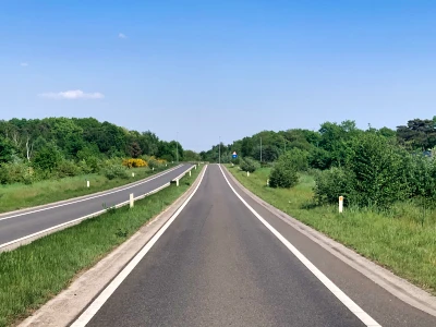 One lane in each direction with a central reservation.